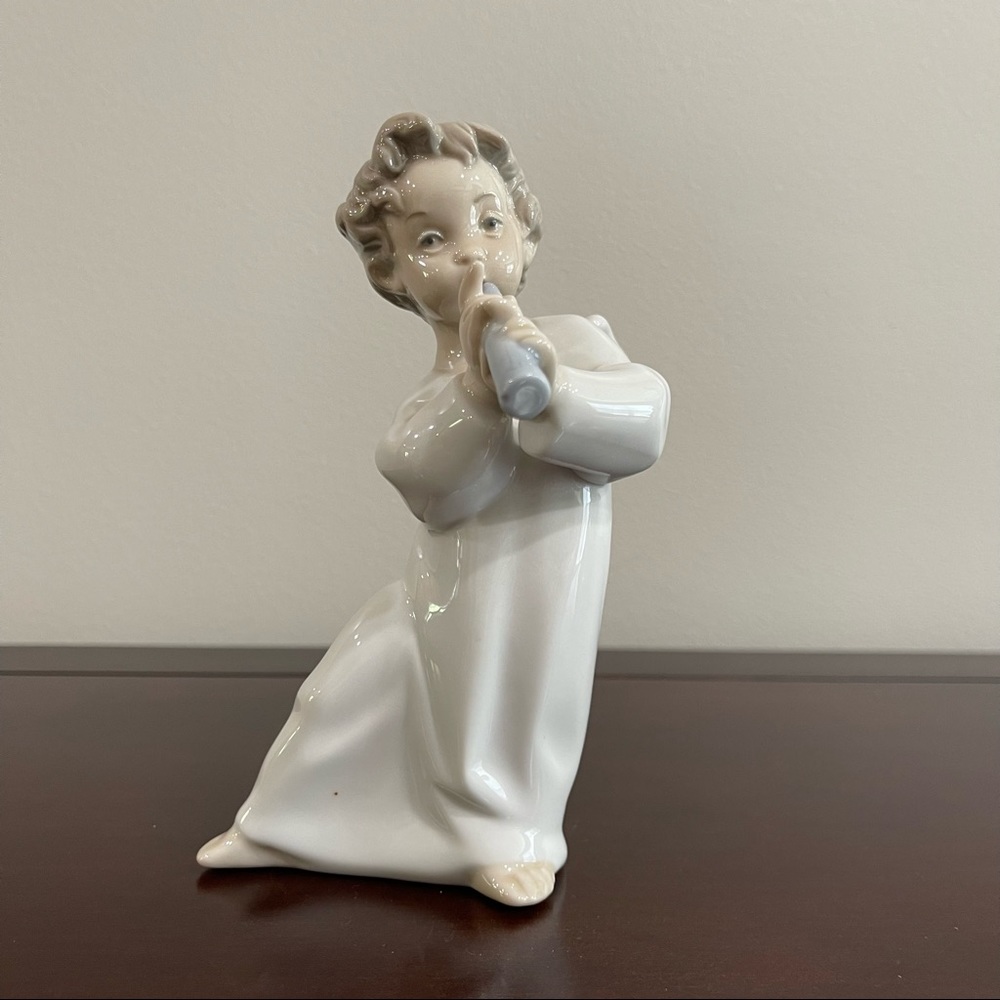 Lladro retired Angel playing horn.